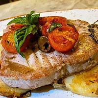 Plate with Fish covered in vegetables